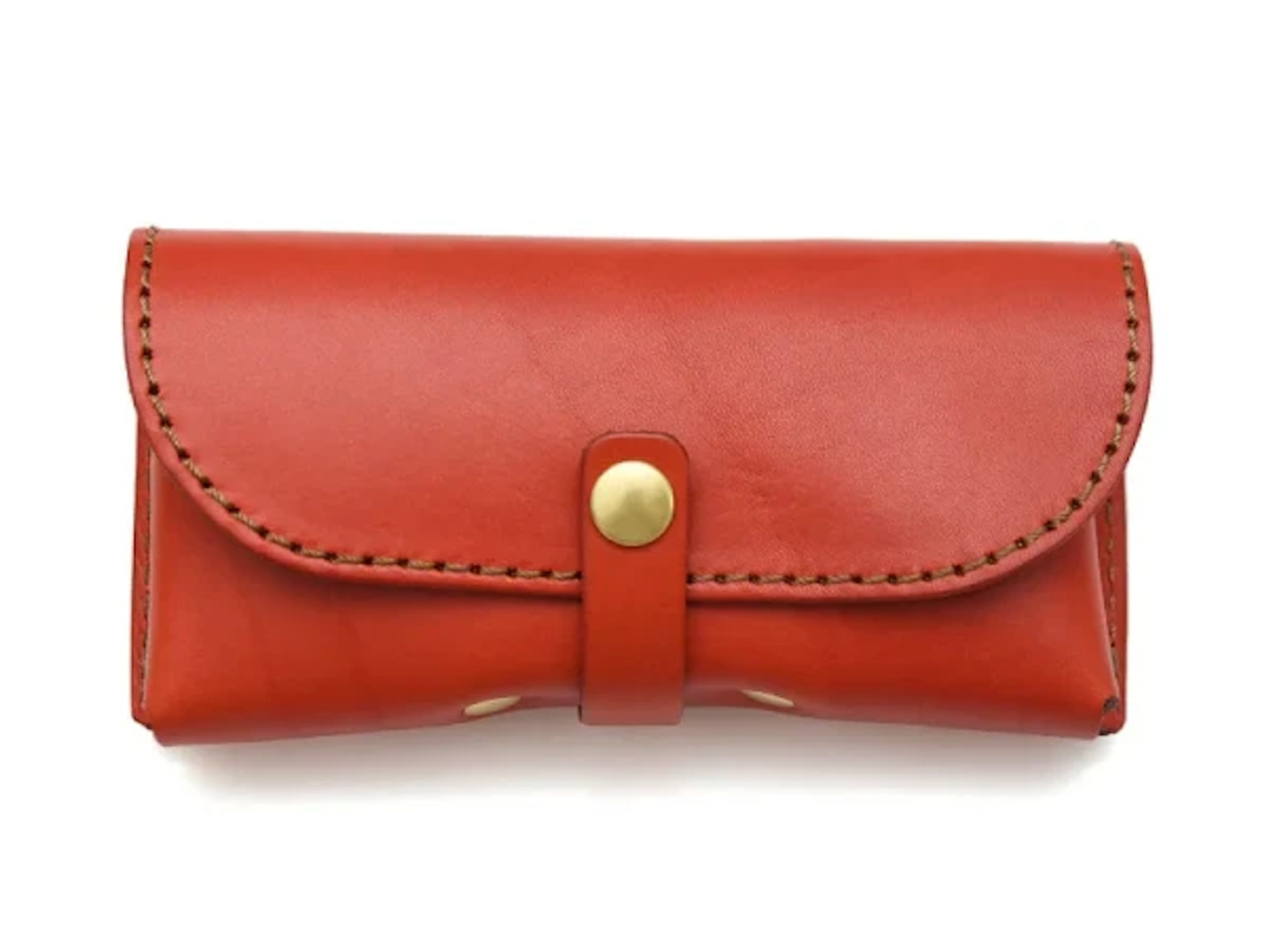 Red leather eyewear bag with a gold buckle on a white background