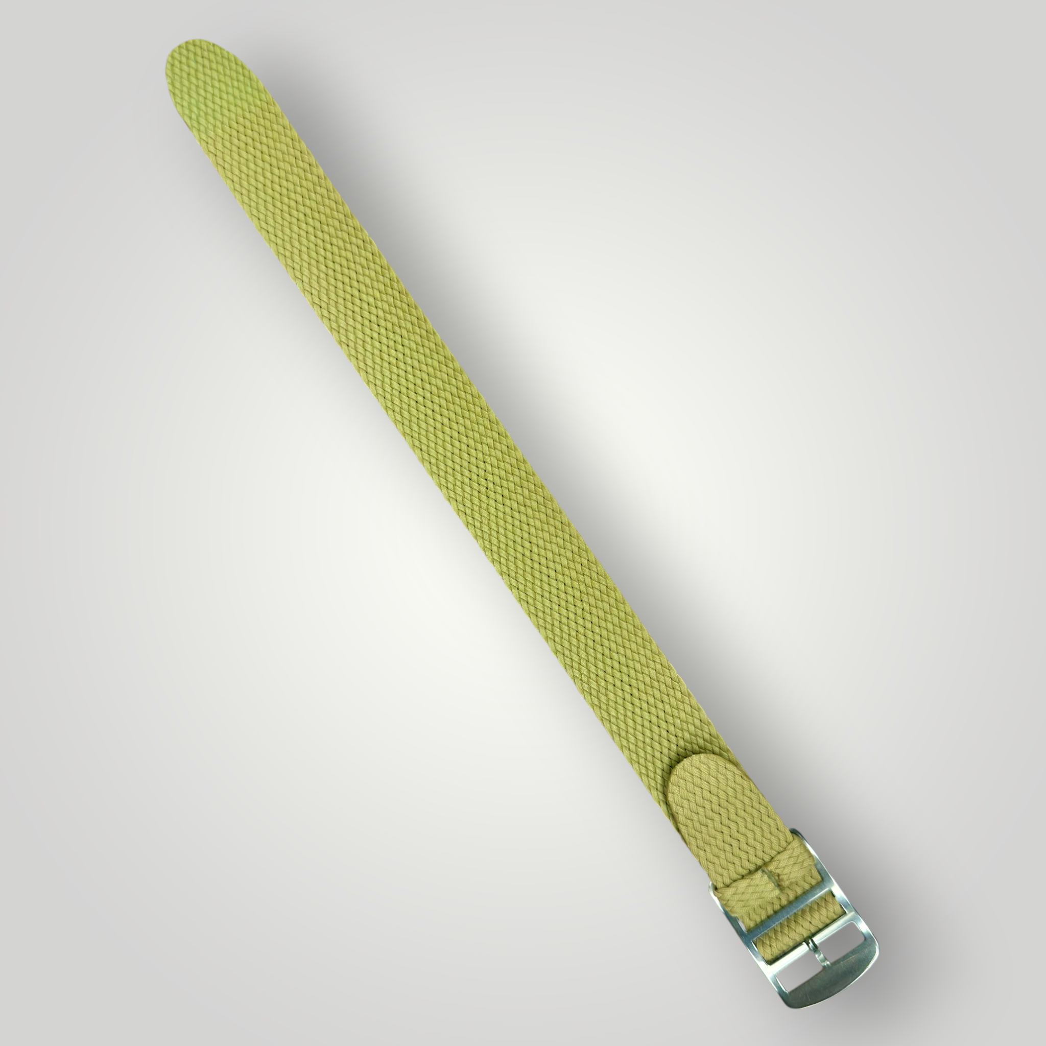 Beige woven strap with a metal buckle on a light gray background
