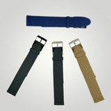 Four woven watch straps in blue, black, and beige on a light gray background