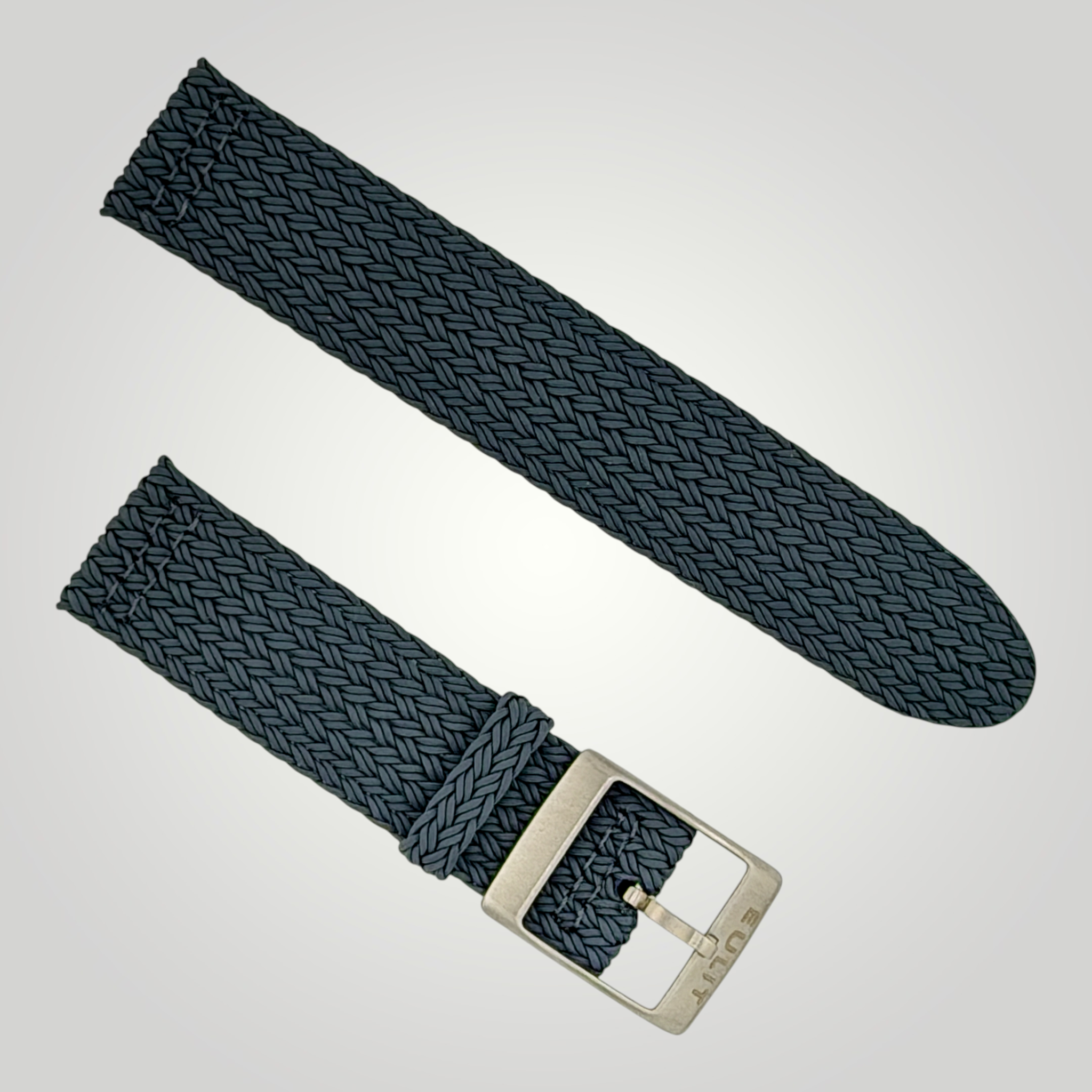 Two dark blue woven watch straps with silver buckles on a light gray background