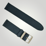 Two dark blue woven watch straps with silver buckles on a light gray background