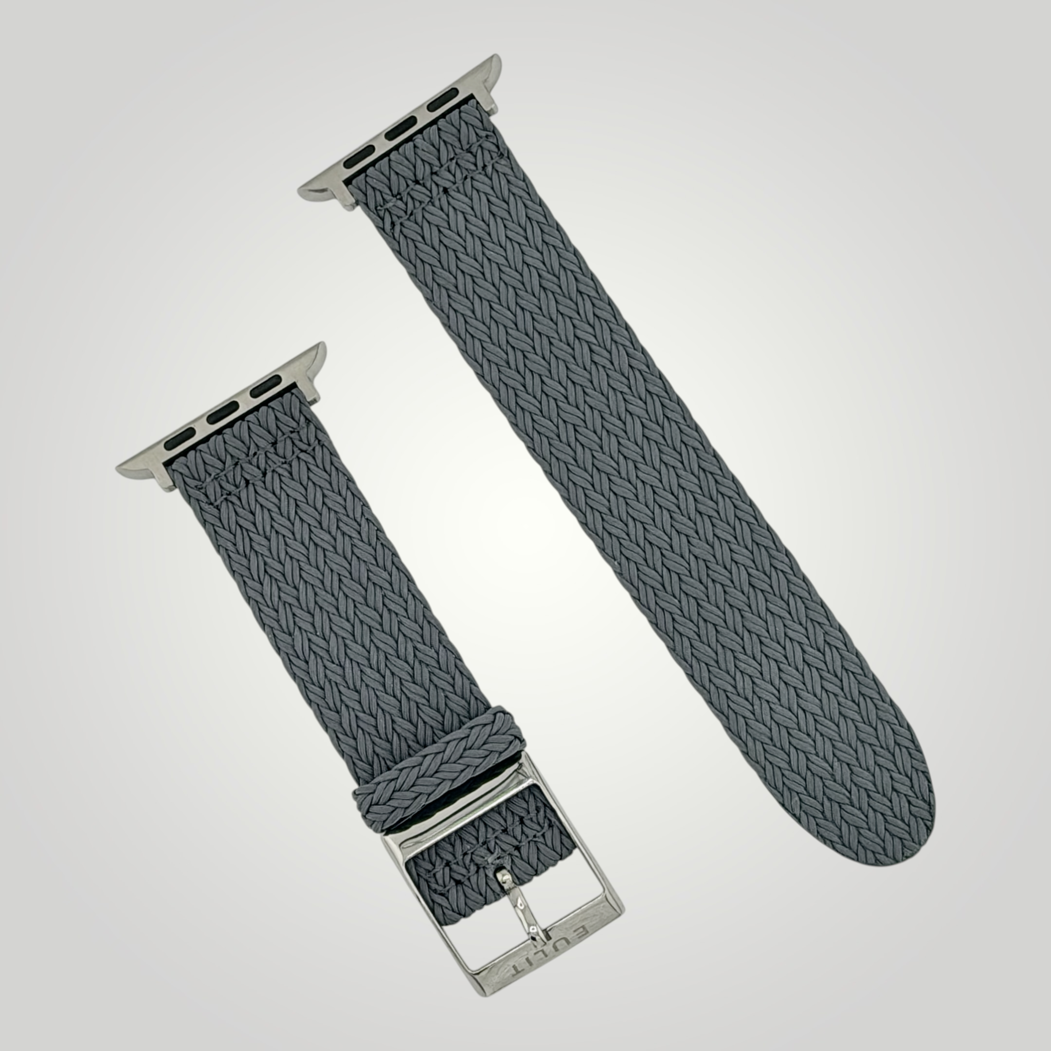 Gray woven watch strap with silver hardware on a light gray background